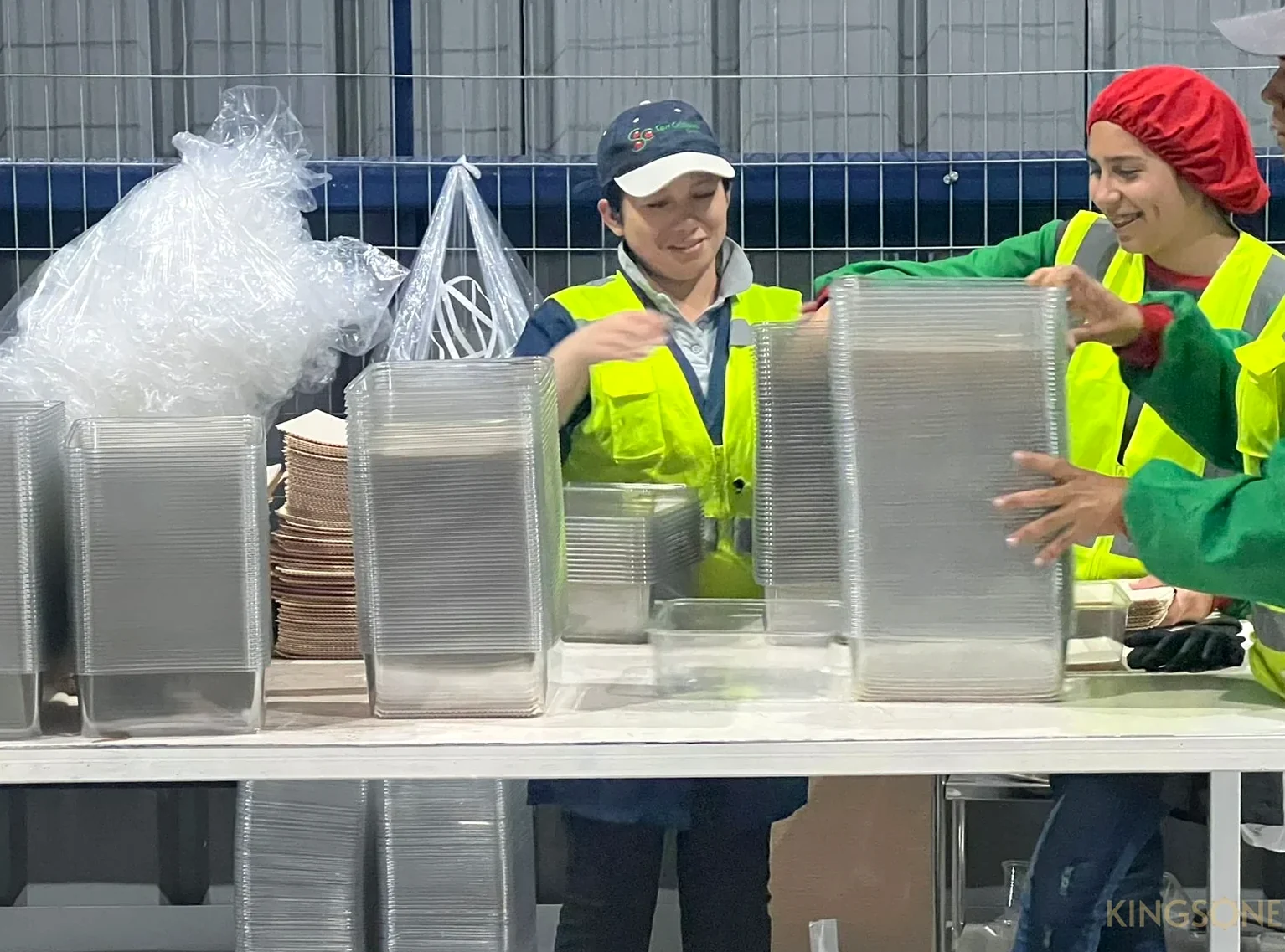 Team reviewing packaging formats in a factory