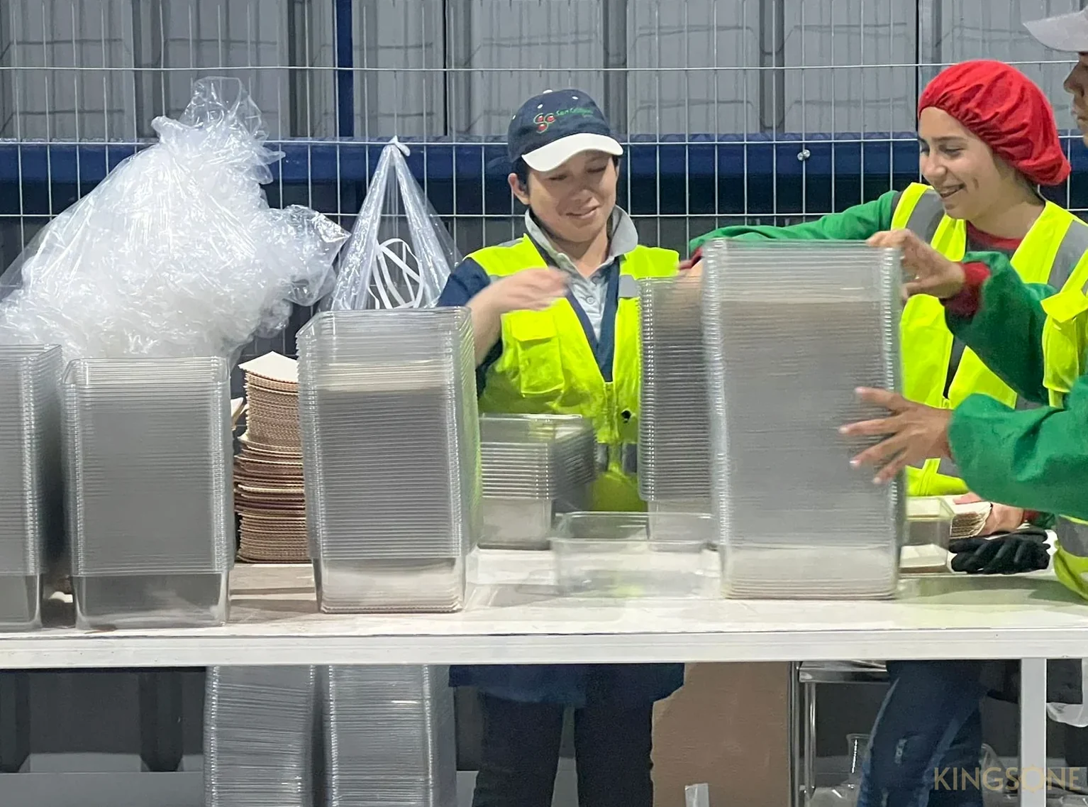 Team reviewing packaging formats in a factory